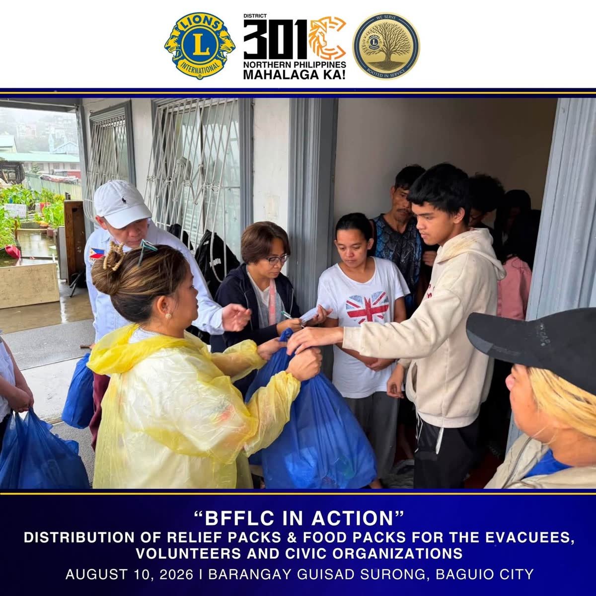 Handing relief goods to families in Northern Philippines