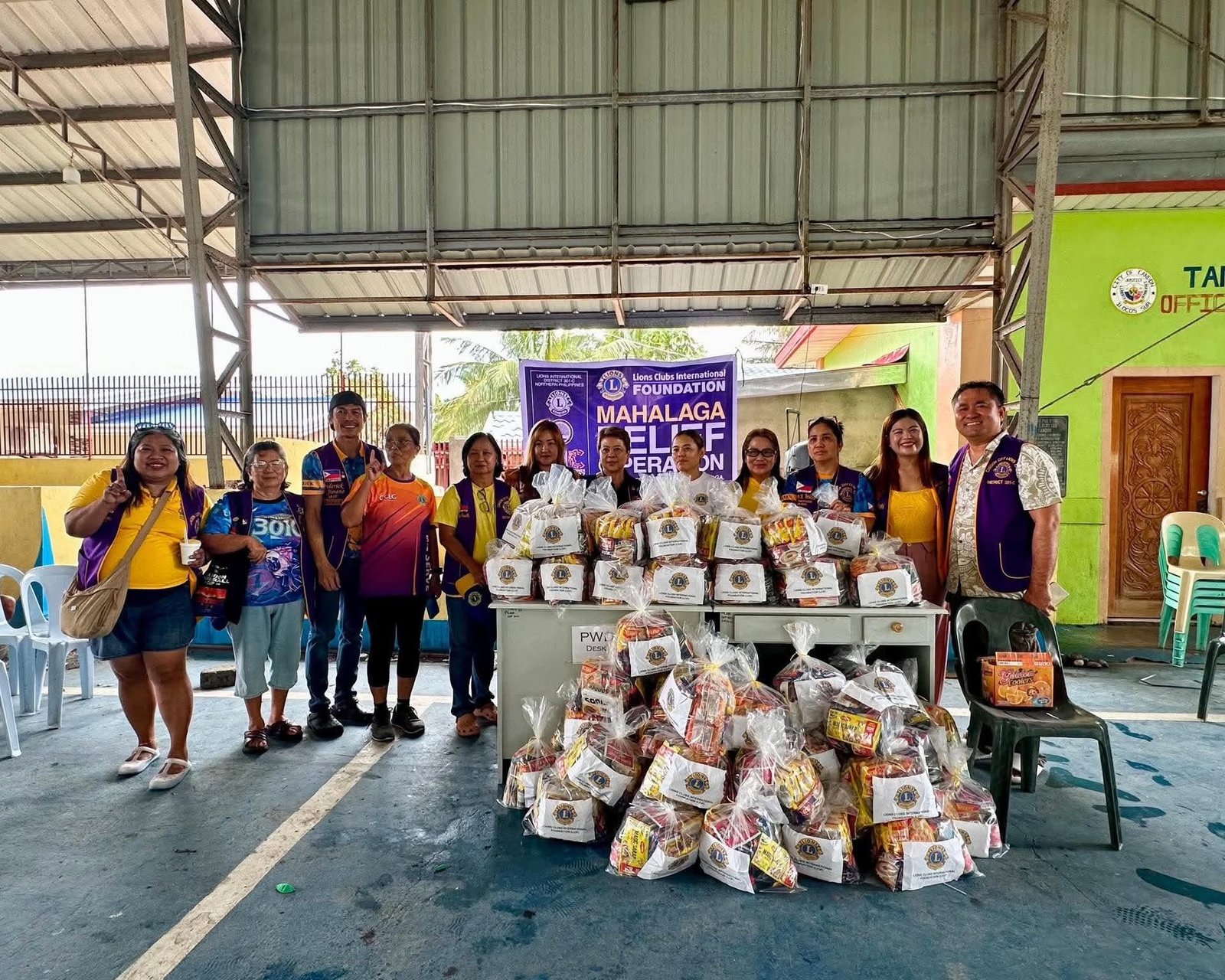 Lions of District 301-C with relief packs prepared for distribution